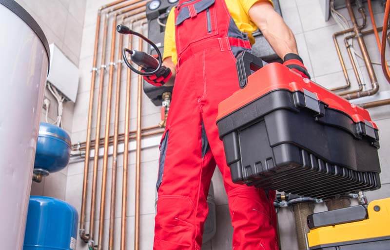 Residential Furnace System Technician At Work